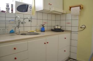 Kuchyň nebo kuchyňský kout v ubytování Kavala Rooms