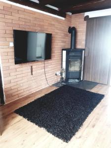 TV a/nebo společenská místnost v ubytování Apartmán BESEDA
