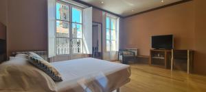 Un pat sau paturi într-o cameră la Casa Grand Galicia