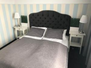 Łóżko lub łóżka w pokoju w obiekcie Rezydencja Sandomierska