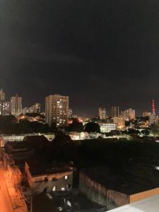 a view of a city at night with buildings at no centro de Cuiabá aptº mobiliado in Cuiabá