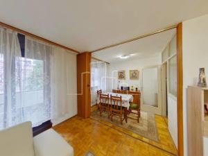 a living room with a table and a dining room at Apartment Ciglane - Pet friendly in Sarajevo
