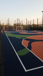 an empty basketball court with a soccer goal at Nyvky Like Home - Fayna Town - apt 398 in Kyiv