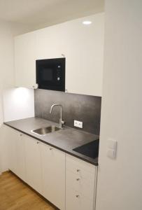 Una cocina o zona de cocina en Luxury Design Apartment