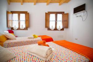 Un pat sau paturi într-o cameră la Holiday Room Sa Tebia