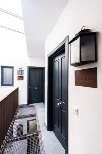TV a/nebo společenská místnost v ubytování Apartamentos El Patio Plaza Mayor Cáceres