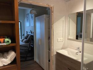 a bathroom with a sink and a mirror at LA CASINA DE PAULA in Ríoseco +38 photos