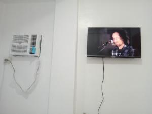 TV a/nebo společenská místnost v ubytování MJ Home + 21 fotografií