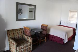 Postel nebo postele na pokoji v ubytování Chalet Motel