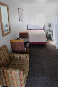 Postel nebo postele na pokoji v ubytování Chalet Motel