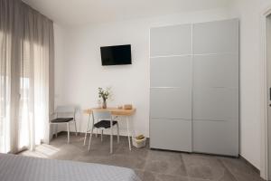 Televízia a/alebo spoločenská miestnosť v ubytovaní Nerissa suites&rooms