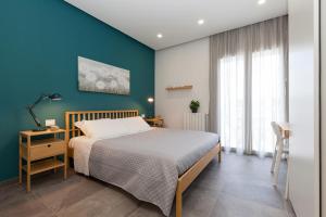 Posteľ alebo postele v izbe v ubytovaní Nerissa suites&rooms