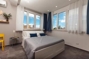 Posteľ alebo postele v izbe v ubytovaní Nerissa suites&rooms