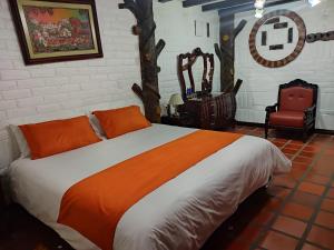 Una cama o camas en una habitación de Jardines De Chamana