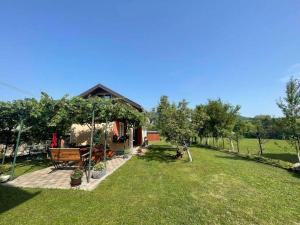 a backyard of a house with a yard with trees at ENNI in Bihać