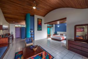 a living room filled with furniture and decor at Xandari Resort & Spa in Alajuela