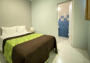 Postel nebo postele na pokoji v ubytování HOTEL GRAN VIA CENTRAL