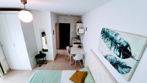 En eller flere senge i et værelse på Apartments Villa Alba