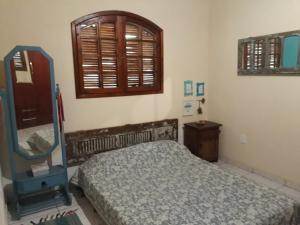 Una cama o camas en una habitación de Hostel Mantiqueira
