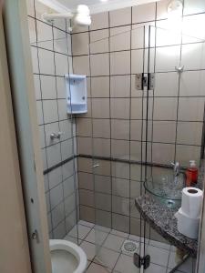 a bathroom with a toilet and a sink at Fiori Caldas Novas - 245 in Caldas Novas +27 photos