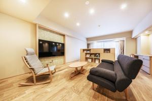 TV a/nebo společenská místnost v ubytování Hotel Mahoroba