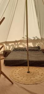 a tent with two mats in a room at Farm Glamping tent on Acquaviva Bay in Marittima