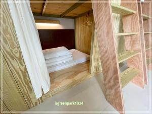 Postel nebo postele na pokoji v ubytování Green Park Homestay