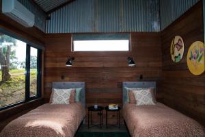 Ένα ή περισσότερα κρεβάτια σε δωμάτιο στο Idlewild Bridgetown