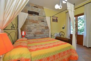 Ein Bett oder Betten in einem Zimmer der Unterkunft Villa Medicina