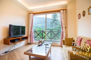 Телевизор и/или развлекательный центр в Tree Lake B&B Hualien