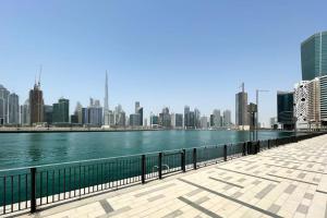 a body of water with a city in the background at Modern Luxury in the Heart of Downtown Dubai in Dubai