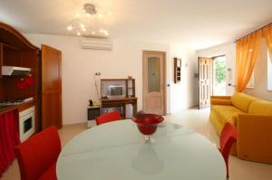 a living room with a table and a couch at Villa Cinzia in Sant'Agnello