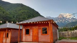 a small cabin with lights on top of it at Guest House Ushba Gate in Mestia