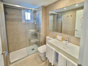 a bathroom with a shower and a sink and a toilet at BQ Belvedere Hotel in Palma de Mallorca