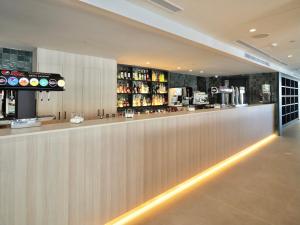 a bar in a restaurant with a counter at BQ Belvedere Hotel in Palma de Mallorca