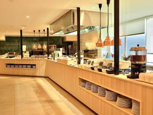 a restaurant kitchen with a counter with plates at BQ Belvedere Hotel in Palma de Mallorca