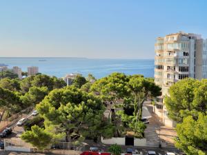a view of a city with trees and a building at BQ Belvedere Hotel in Palma de Mallorca