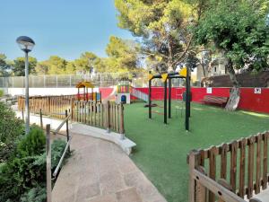 a playground in a park with at BQ Belvedere Hotel in Palma de Mallorca