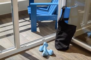 a black bag sitting on the floor next to a mirror at Star inn Peniche in Peniche