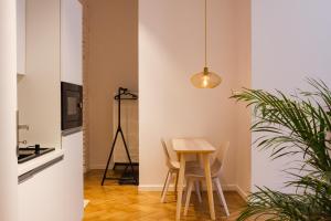 Kép Sympatyczne studio z palmą areka / A nice studio with areka palm tree szállásáról Łódźban a galériában