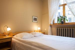 Postel nebo postele na pokoji v ubytování Guesthouse Jakob Lenz