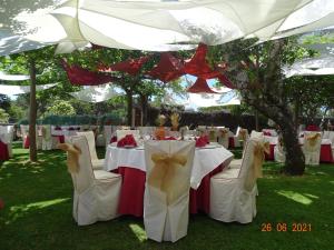 a table set up for a wedding under a tent at Hotel Sierra Quilama in San Miguel de Valero