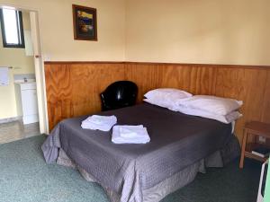 Postel nebo postele na pokoji v ubytování New Central Hotel Woodville