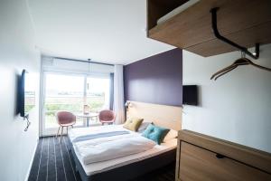 Letto o letti in una camera di Comwell Middelfart