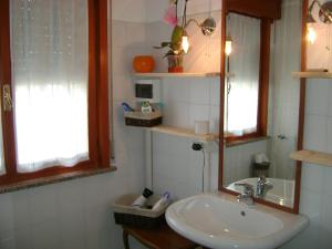 a bathroom with a sink and a mirror at B&B Lattemiele in Fontanellato +43 photos