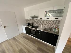 Kuchyň nebo kuchyňský kout v ubytování Apartman Discoveryou