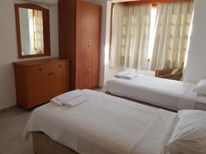 Postel nebo postele na pokoji v ubytování Dolphin Apartments + 20 fotografií