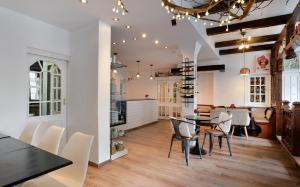 a kitchen and dining room with a table and chairs at Hotel Zehnthof in Cochem