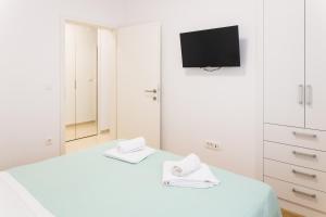 Postel nebo postele na pokoji v ubytování Apartment Zara - luxury apartment with private pool