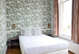 Voodi või voodid majutusasutuse Hotel Sebel toas